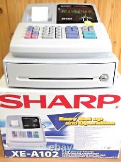 Caisse enregistreuse Sharp Xe A102w en parfait état à 100%, entièrement garantie pour un an.